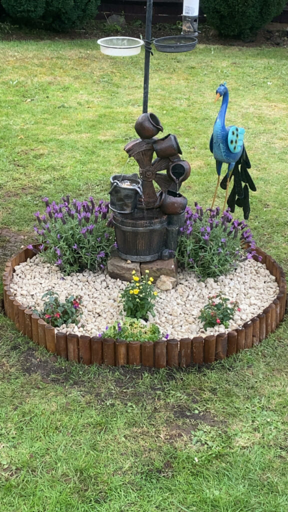 Completed planting feature with fresh plants and tidy borders